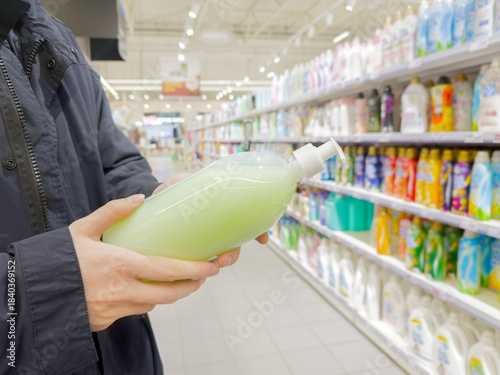 Choosing washing powder ,detergent,liquids at Groceries.