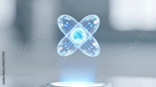 Holographic glowing atomic model nucleus electron orbit slowly rotates above futuristic platform soft blue light floating surface