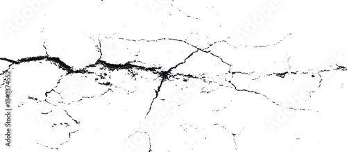 Weathered black and white grunge wall with scratched background. damaged aged stone surface featuring abstract cracked pattern.