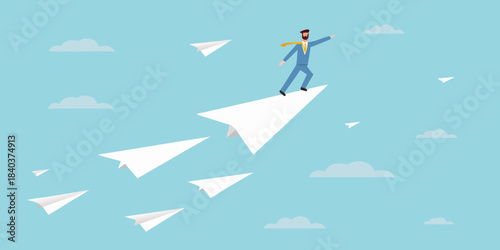 A man stands on a paper airplane reaching for success and flying high