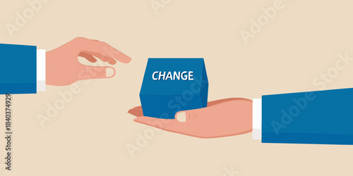 Hands exchanging a blue block with the word change written on it
