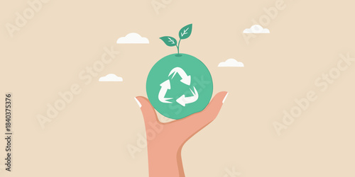 Hand holding a green sprout with a recycling symbol representing environmental care