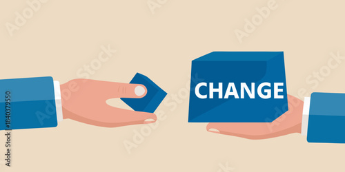 Hands exchanging a blue cube with the word change on it