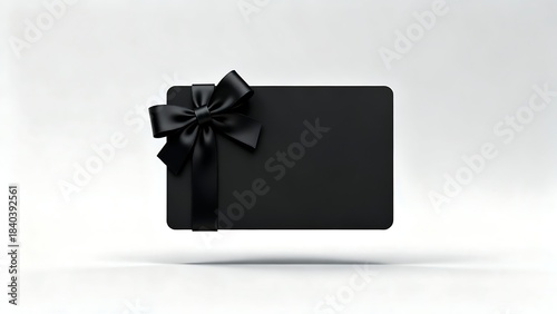 Blank black gift business card with black ribbon bow isolated on white background with shadow minimal concept 3D rendering
