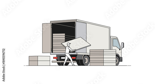 Delivery worker loading boxes into a truck in a commercial setting  