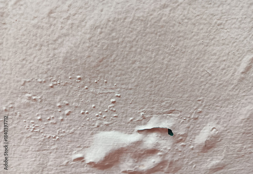 Canvas Print Close up of abstract texture bubbling, blistering and flaking  beige paint in a wall surface