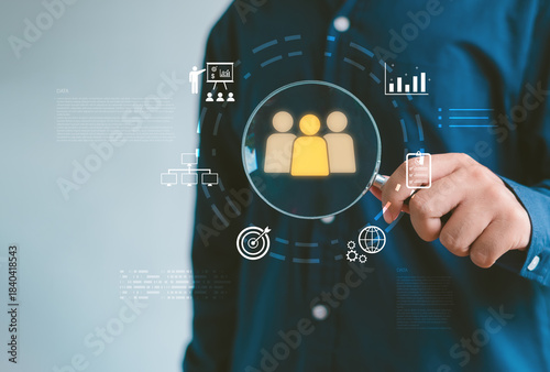 person holding magnifying glass with digital audience icons, symbolizing customer targeting, data analytics, market research, business strategy for identifying ideal users and improving performance.