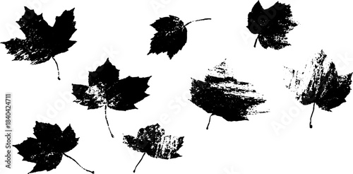 Black and white stencil art with scattered autumn leaves design for seasonal decor