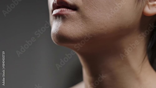 Close-up macro detail of dull dry skin texture on jawline and neck commercial beauty concept