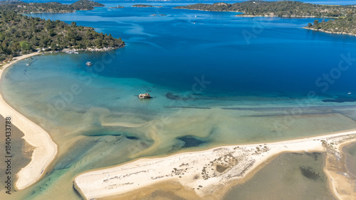 Aerial drone view of Fteroti Beach, sandbanks and lagoon in Sithonia, Chalkidiki, Greece