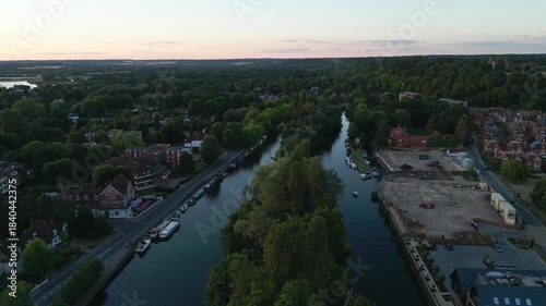 Wallpaper Mural Aerial view of a riverbend lined with trees and buildings at dusk. Torontodigital.ca