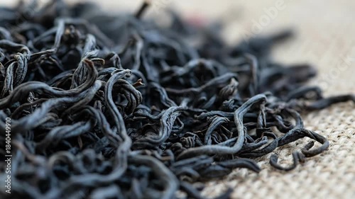 Close-up of Twisted Black Threads on Textured Fabric