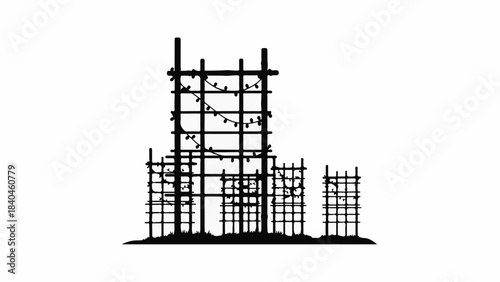 Intricate scaffolding structure illuminated by delicate string lights at twilight