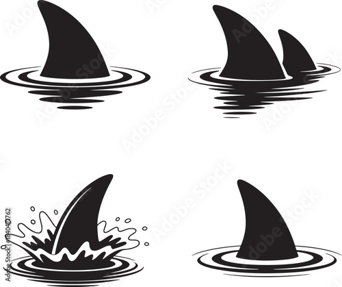 Set of four black and white shark fins emerging from water