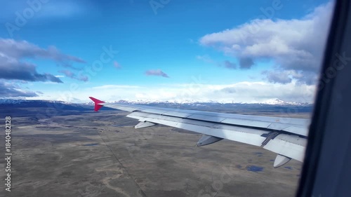 Aerial View from Airplane Window Flying Over Andes Mountains