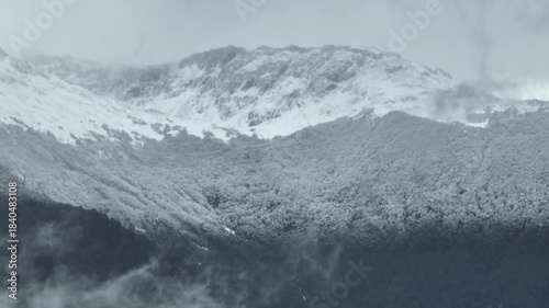 Aerial view cloudy sky over snow-capped Andes mountains in Coyhaique, Chile