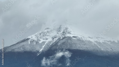 Aerial view cloudy sky over snow-capped Andes mountains in Coyhaique, Chile