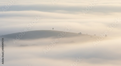 Elevated View of Misty Hilltop at Sunrise