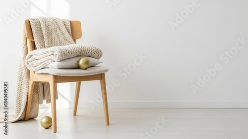 Wooden dining chairs and a wood table furnish a luxury home interior with natural wood floor and wall decor
