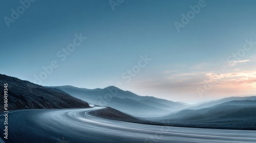 Winding road through misty mountainscape