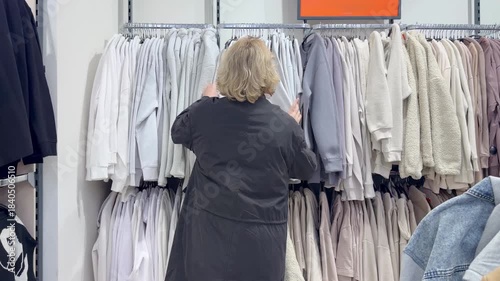 choosing clothes in a shopping mall. clothes hangers
