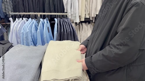 choosing clothes in a shopping mall. clothes hangers