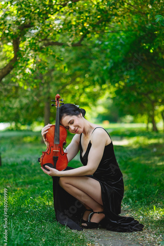 Violinist in nature with cherished instrument