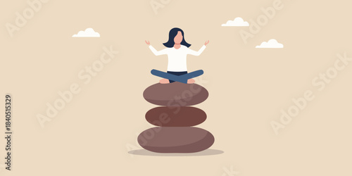 Woman meditating in a peaceful pose atop a stack of balanced stones