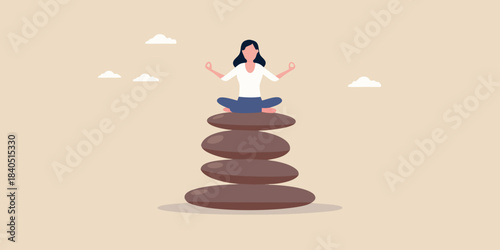 Woman meditating in lotus position atop a balanced stone tower