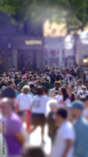 Crowd of people, busy summer shoppers in the centre of European City, shallow focus