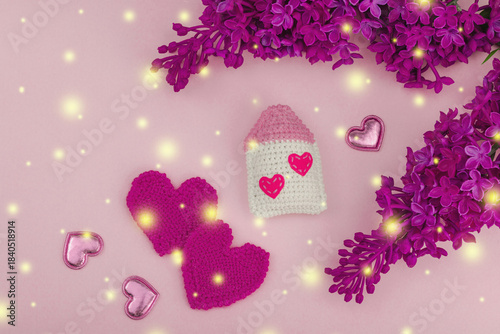 Handmade Valentines Day concept. Creative house figurines, traditional hearts, spring crocheting