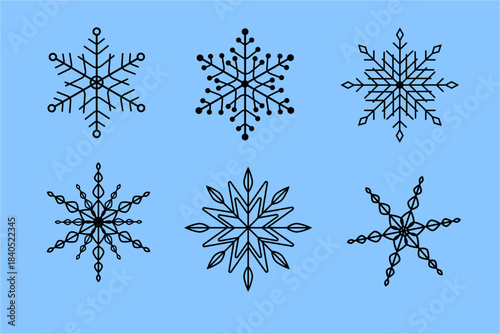 Different snowflakes in black outline on a blue background showing unique designs and shapes for winter decorations and crafts