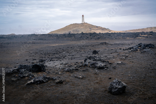 Schilderij op canvas Reykjanes Lighthouse seen from the coast in Iceland's Reykjanes Peninsula on a c