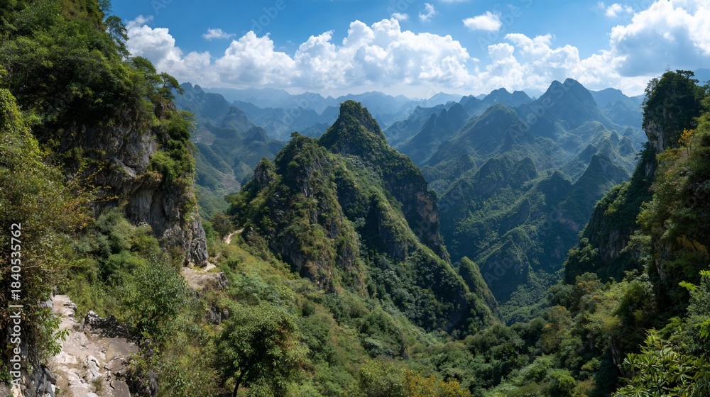 Obraz premium Mountainscape with sharp peaks under a cloudy sky