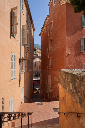 Grasse, France - June 12, 2025 - charming alleyway with buildings in a European town on a sunny day