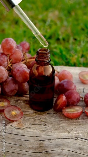 Grape seed extract in the garden. Selective focus.