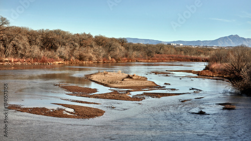 Φωτογραφία Autumn River with Sandbars and Warm Foliage