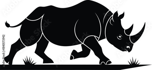 Vector black silhouette of a powerful rhinoceros charging on the savannah grass, detailed African wildlife animal symbol or mascot design.