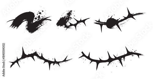 Thorny ink brushstrokes with splatters create a set of distressed artistic design elements, perfect for edgy aesthetics and grunge-themed graphic projects.