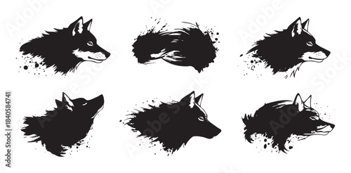Stylized wolf heads collection featuring various artistic ink splash grunge silhouettes, perfect for graphic design elements and wild animal themes.