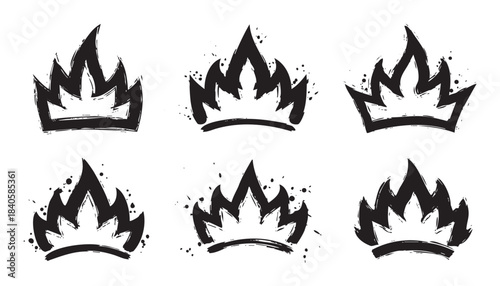 Stylized grunge crown icons featuring a dynamic fiery and powerful brush stroke design, ideal for various graphic projects and branding.
