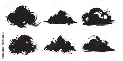 Ink brush strokes create a collection of abstract, textured shapes with a dynamic, artistic flair, perfect for graphic design elements.