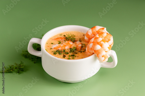 Traditional creamy shrimp soup served warm with aromatic seasoning and garnish