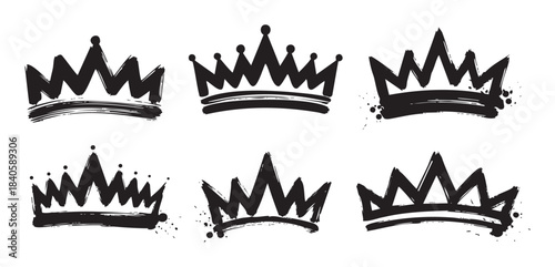 Six black grunge hand drawn crown illustrations with a rough brushstroke texture and paint splatters, perfect for various graphic design projects.
