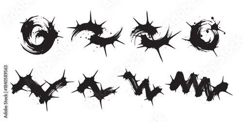 Abstract ink brush strokes with sharp edges and splatters create a dynamic and edgy grunge design element collection for creative projects.