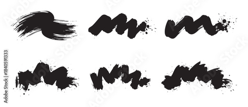 Abstract black ink brush strokes with grunge texture and splatter details, perfect for artistic design elements and creative overlays.