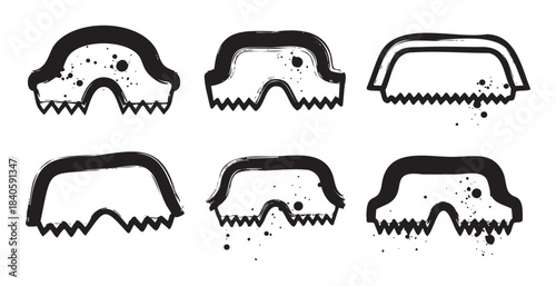 Abstract black grunge jaw shapes with jagged teeth and ink splatters create a primal, stylized design element for various creative projects.