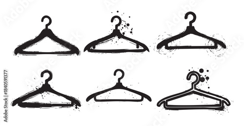 Six distressed clothes hangers with various grunge and brushstroke textures are arranged in a stylish collection, perfect for fashion and retail design elements.