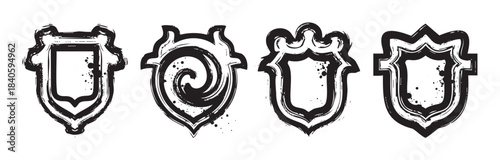 Four unique grunge shields with distressed brush stroke textures and various shapes, ideal for emblems, logos, or decorative design elements.