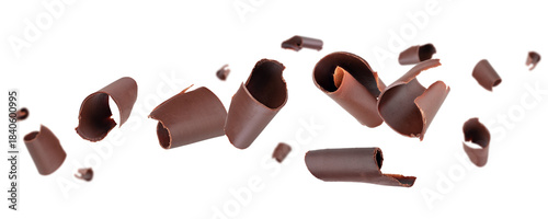 Chocolate curls fly and levitate in space. Isolated on white.